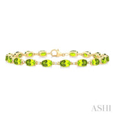 6X4 MM Oval Cut Peridot and 1/6 ctw Round Cut Diamond Semi Precious Tennis Bracelet in 10K Yellow Gold